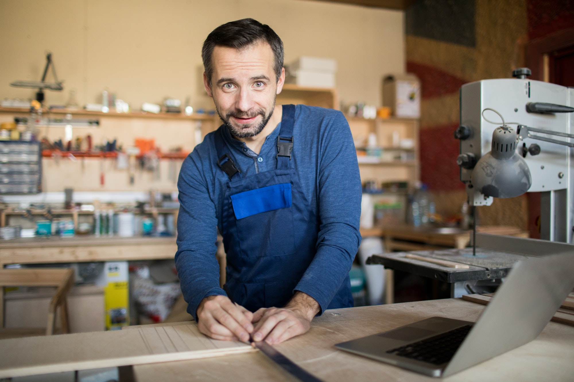 Carpenter Posing in Workshop