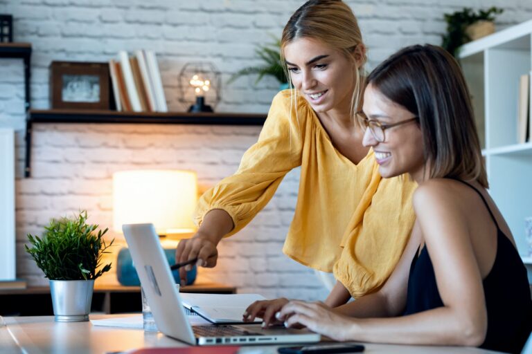 Two freelance business women in their startup small business.