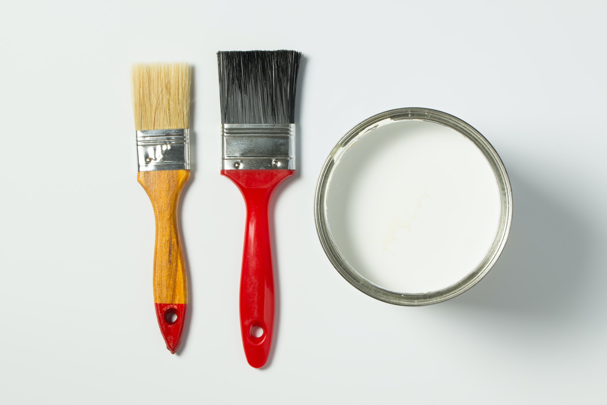 White paint and paint brushes