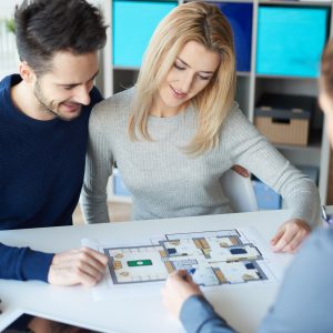 Couple meeting with real estate agent